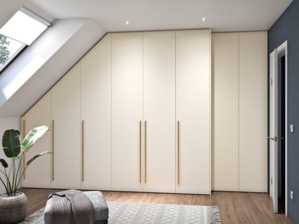 Built-in wardrobe with classic doors under a slanted wall, with adjusted depth for comfortable entry into the room.